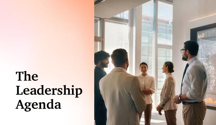 Business team discussing in a modern office with charts displayed on a screen nearby. Business team discussing in a modern office with charts displayed on a screen nearby.