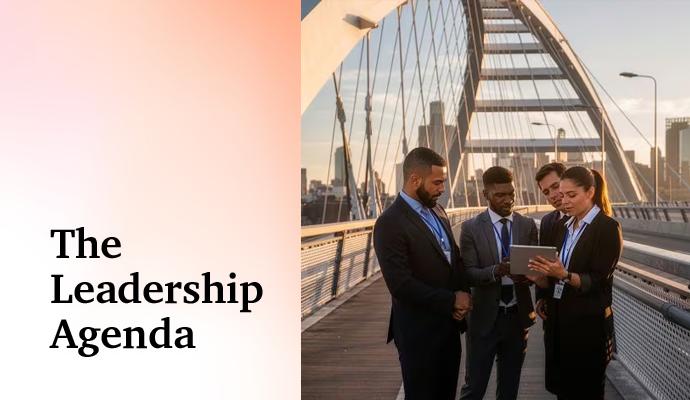 “Business colleagues gathered outdoors on a pedestrian bridge, reviewing information on a tablet. “Business colleagues gathered outdoors on a pedestrian bridge, reviewing information on a tablet.