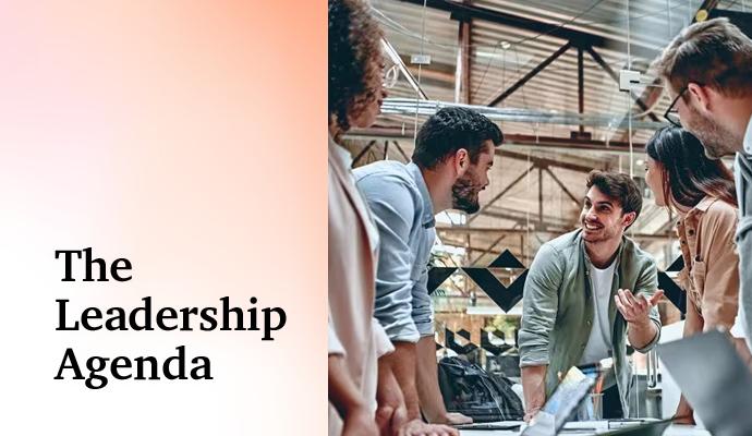 Group of coworkers gathered around a table, discussing a project in a modern workspace. Group of coworkers gathered around a table, discussing a project in a modern workspace.